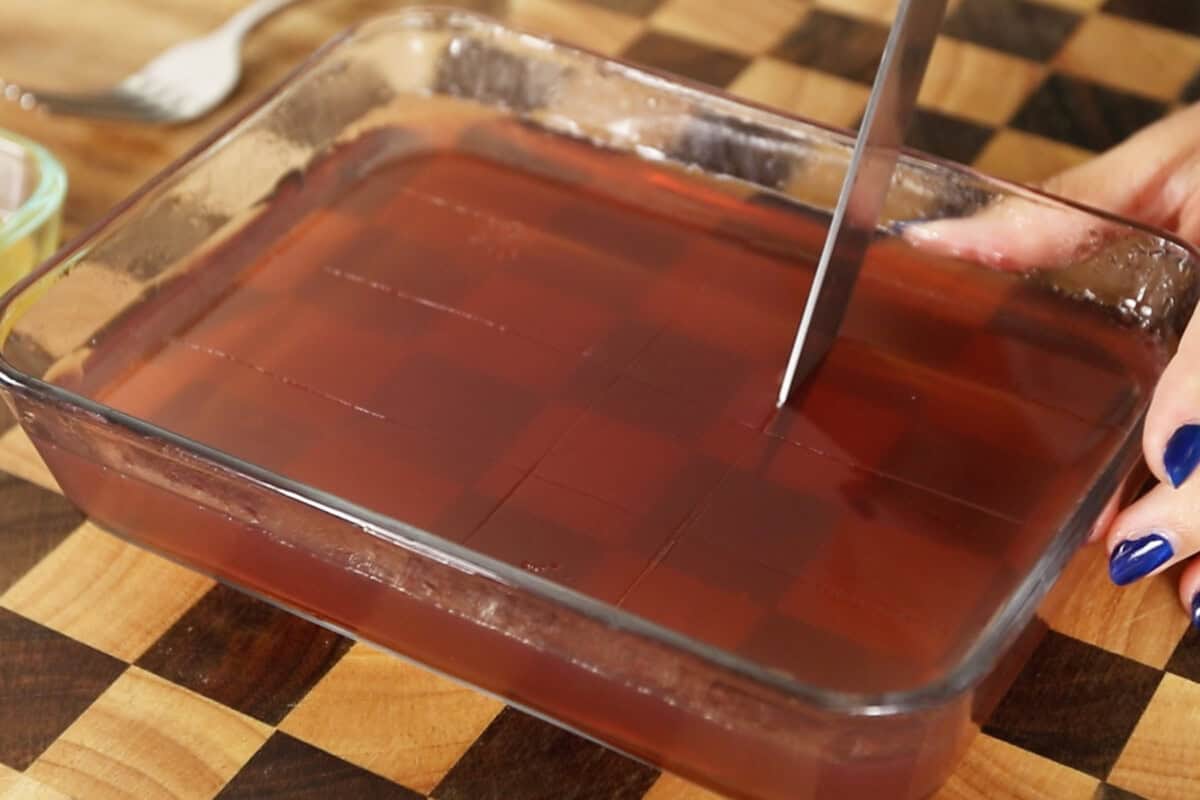 slicing set vegan jello cubes in container