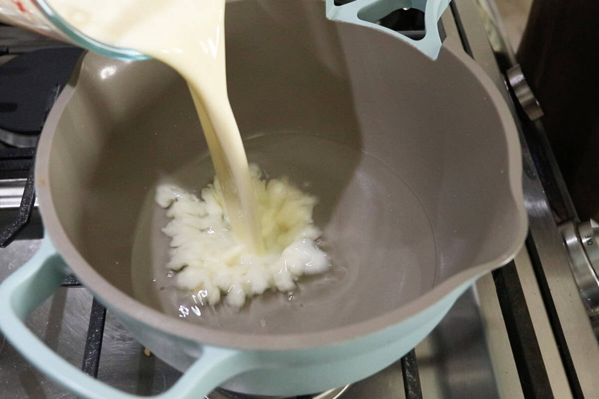 step by step: adding non-dairy milk to water in a pot