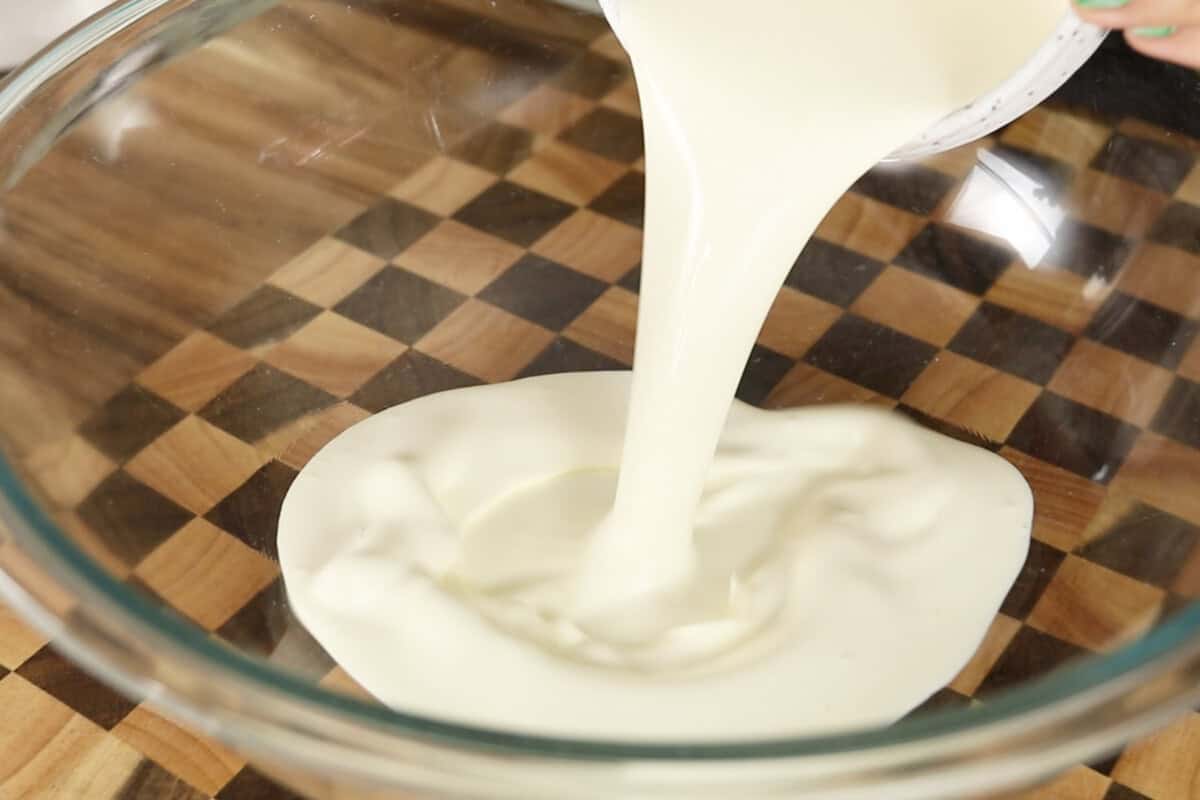 step by step: adding heavy cream to a bowl