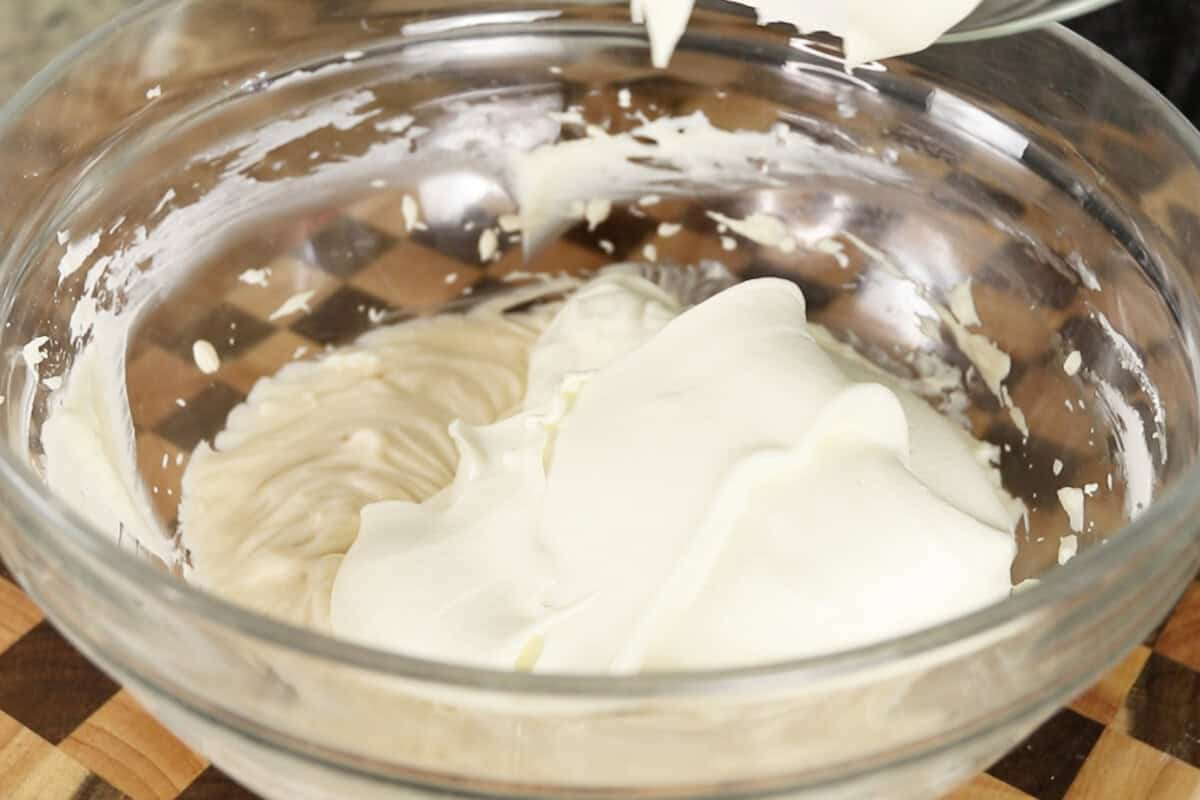 step by step: fluffy whipped cream in a bowl