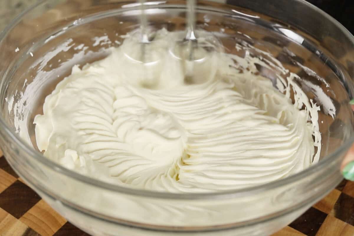 step by step: whipped heavy cream in a bowl