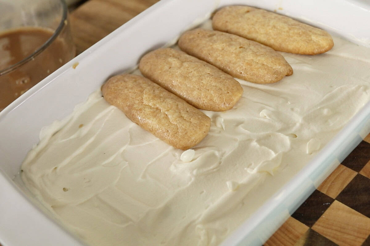 step by step: adding second layer of ladyfingers on top of cream