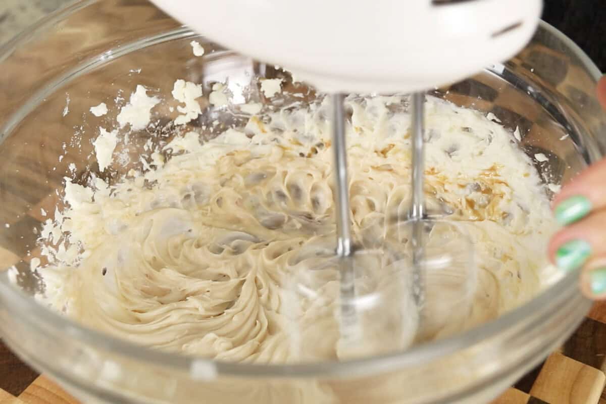 step by step: mixing the chai into the cream cheese and sugar with a hand mixer