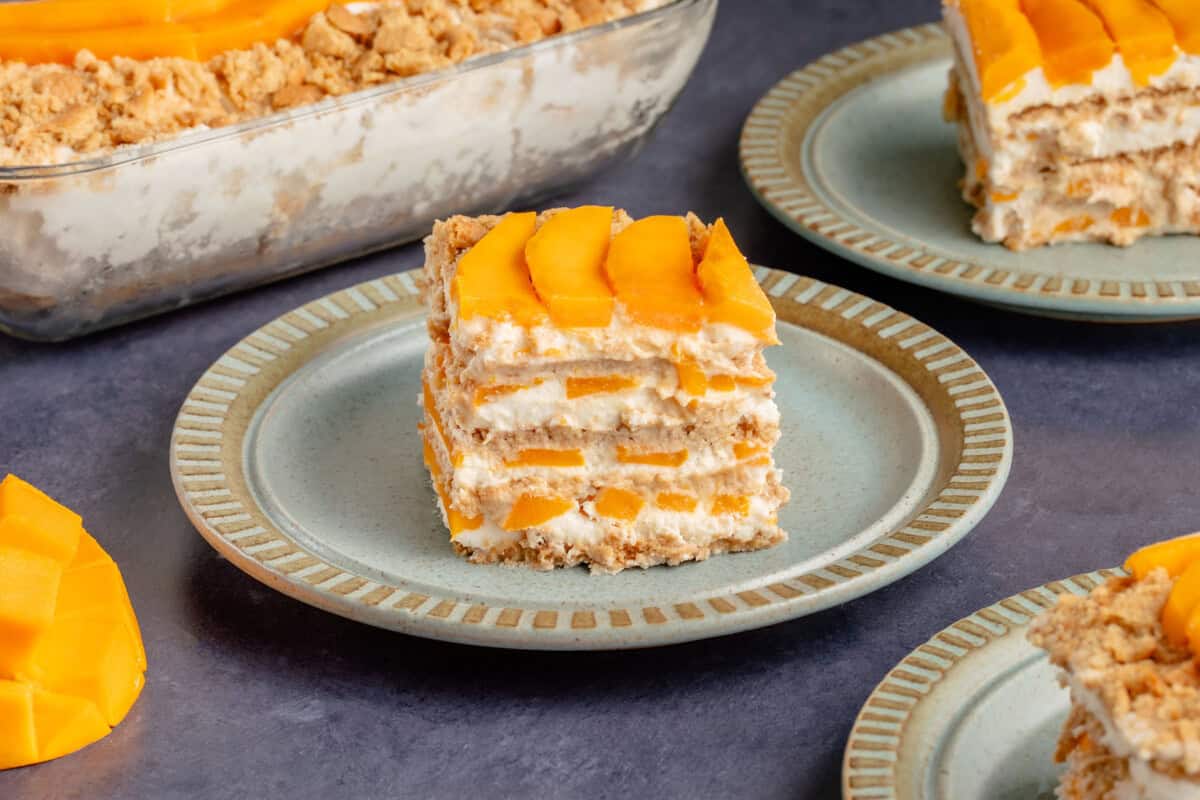 mango float on a plate surrounded by other dishes