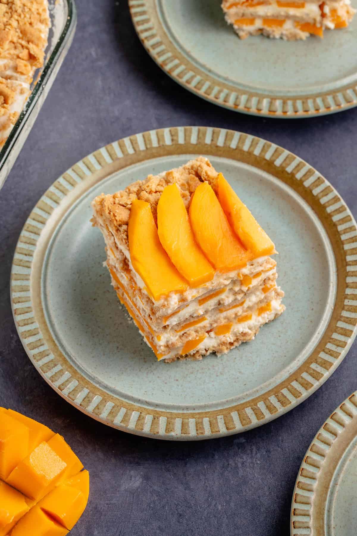 slice of mango float on a blue plate