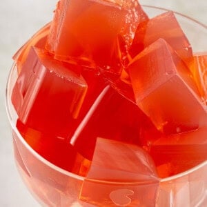 glass filled with cubed red vegan yellow