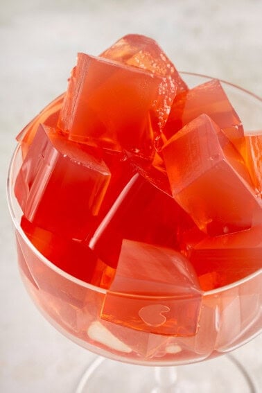 glass filled with cubed red vegan yellow