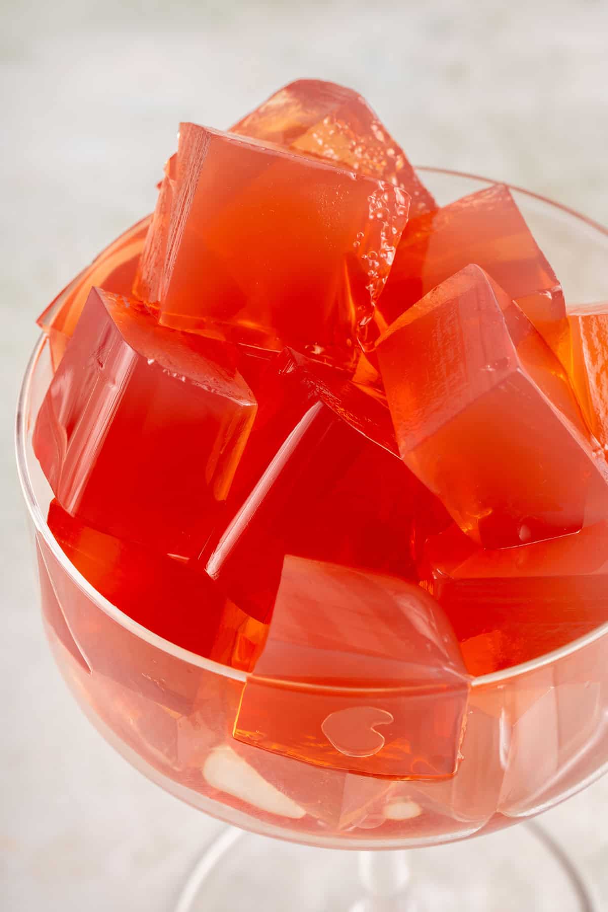 glass filled with cubed red vegan yellow