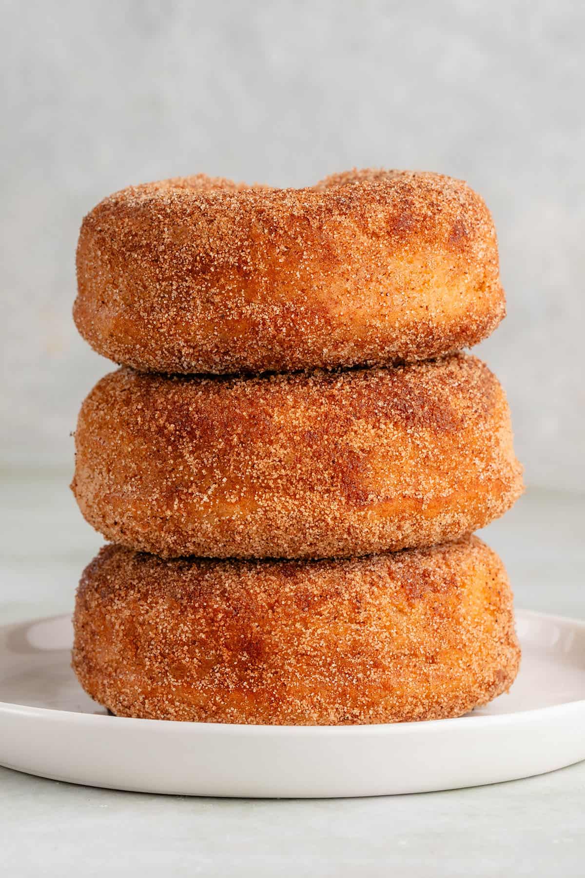 stack of three baked apple cider donuts