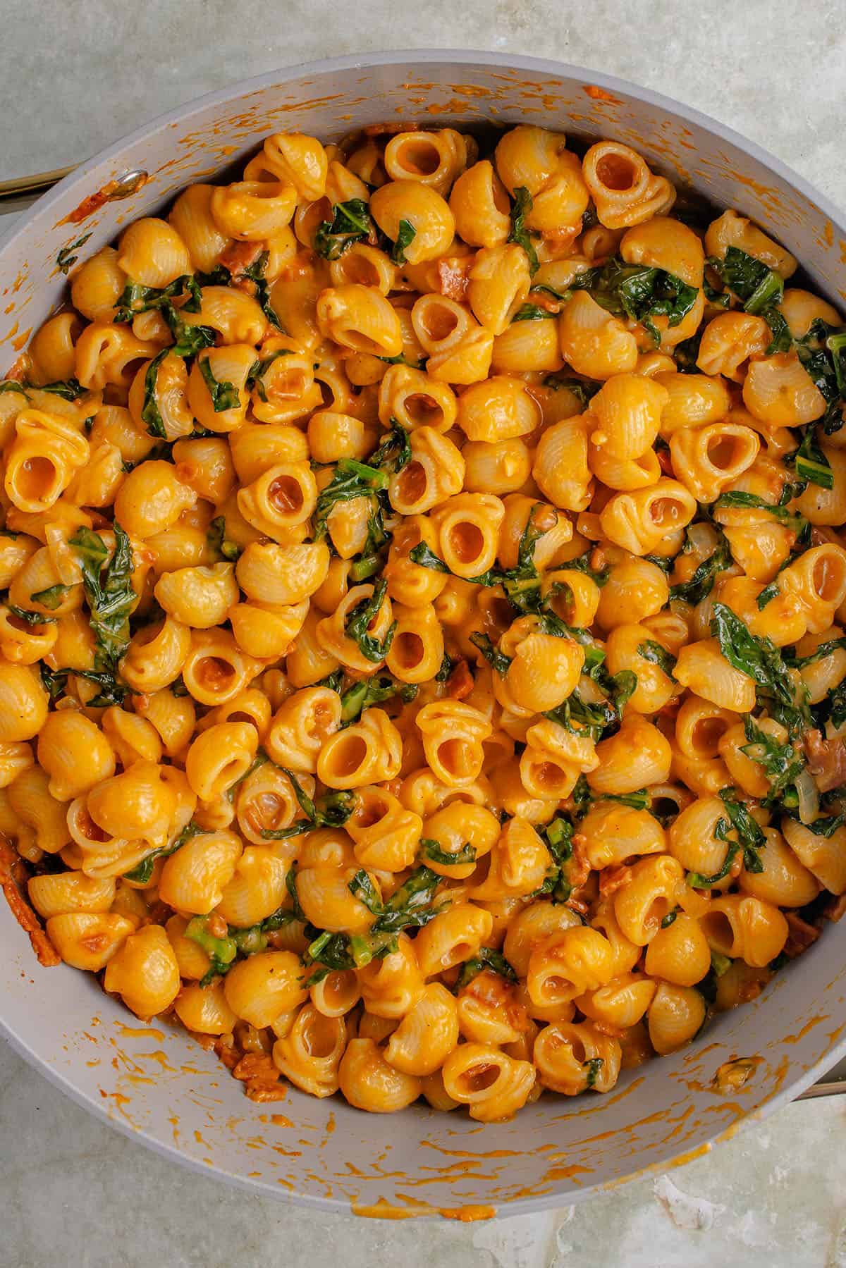 overhead up photo of creamy vegan pumpkin mac and cheese in pan