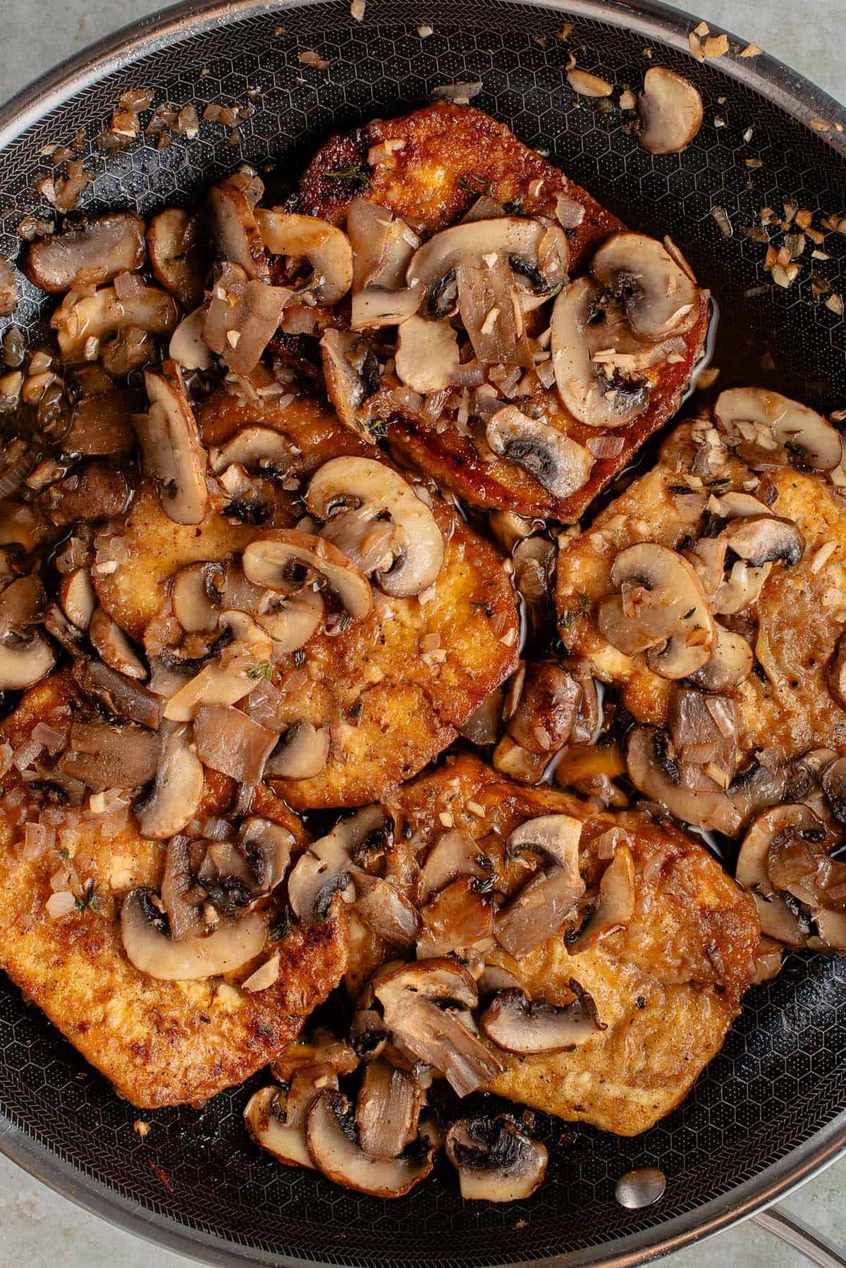 skillet filled with tofu marsala