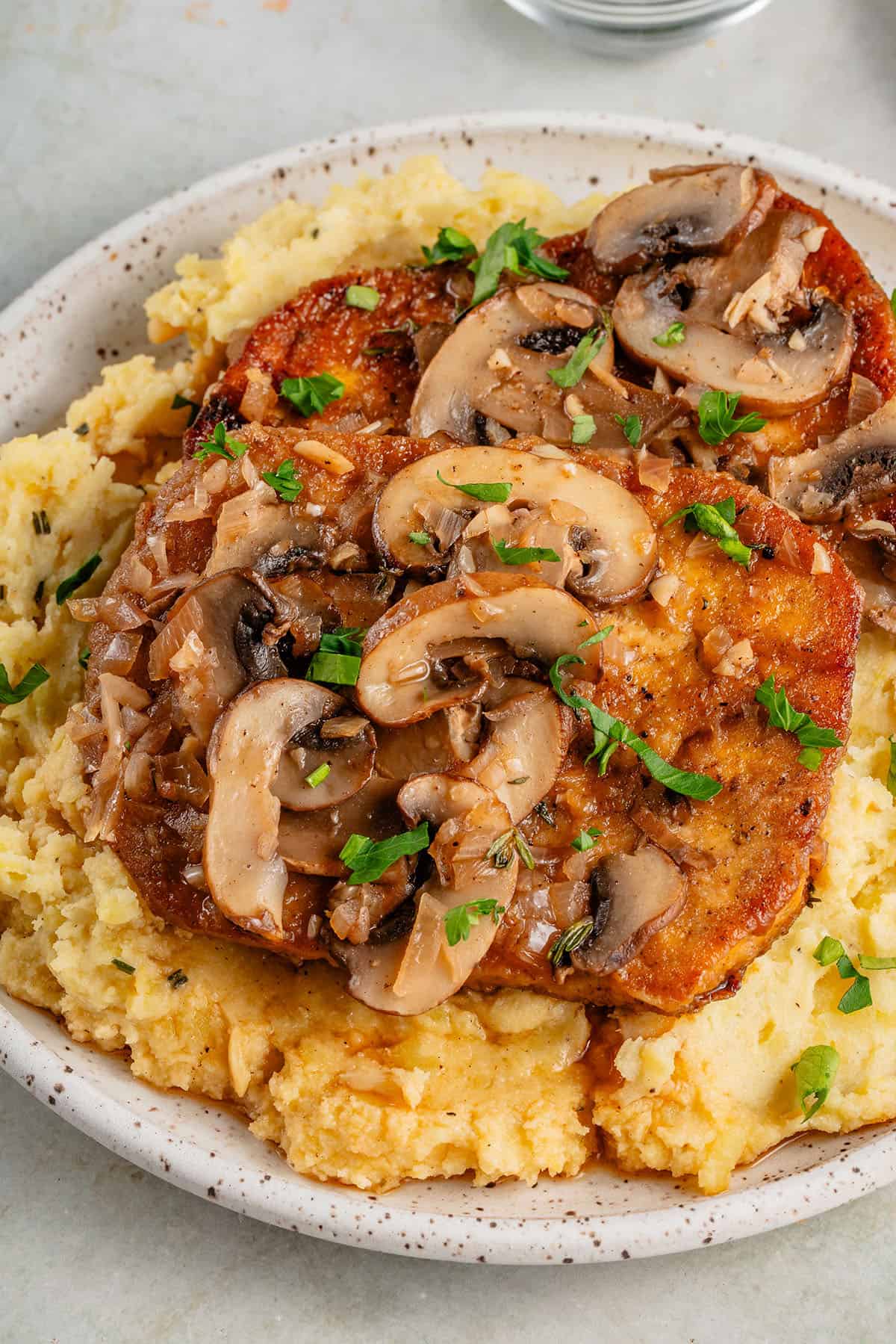 mashed potatoes with vegan tofu marsala on top