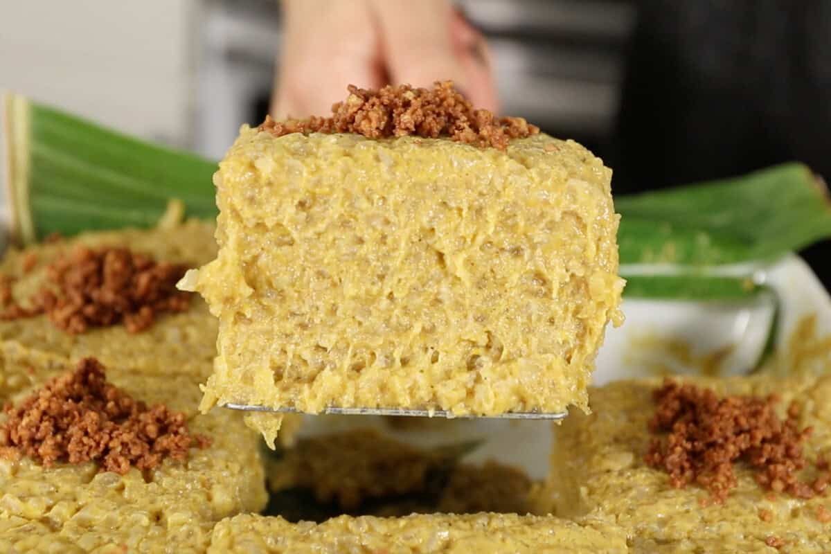 spatula holding a slice of Biko Kalabasa (Pumpkin Biko)