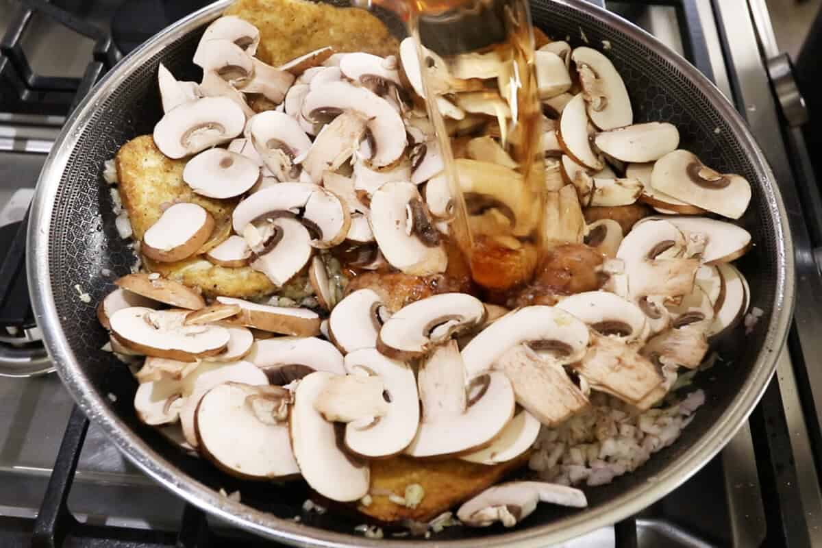 adding marsala wine to skillet