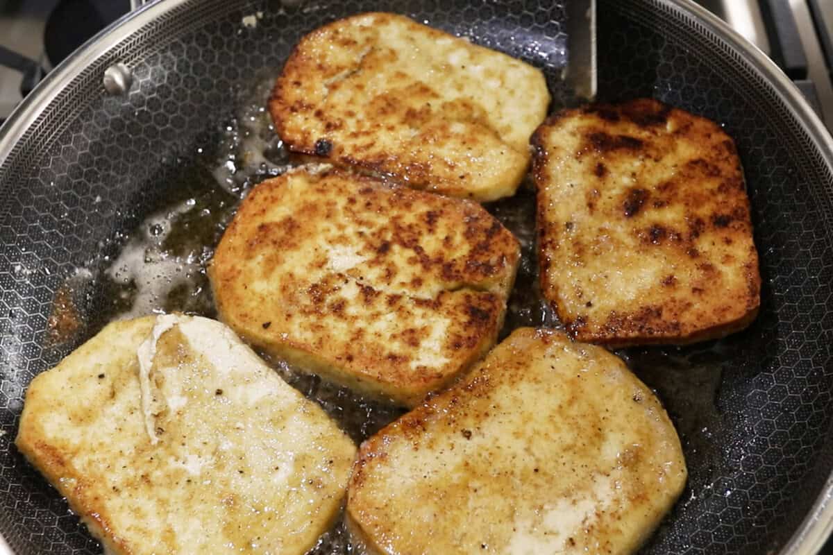 frying tofu in a large skillet