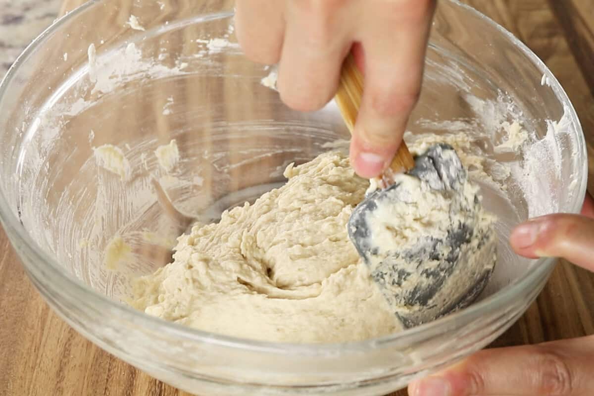 preparing the batter for vegan coffee cake in large glass bowl