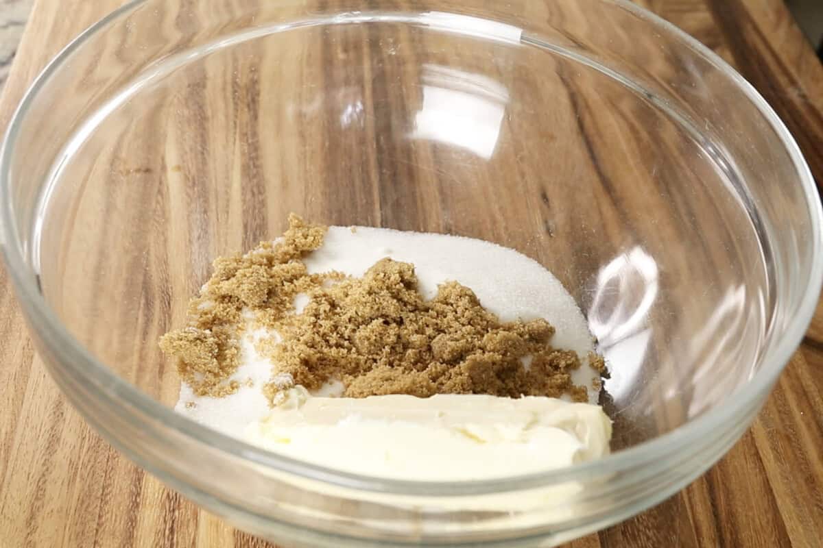 sugar, brown sugar and softened butter in large glass bowl