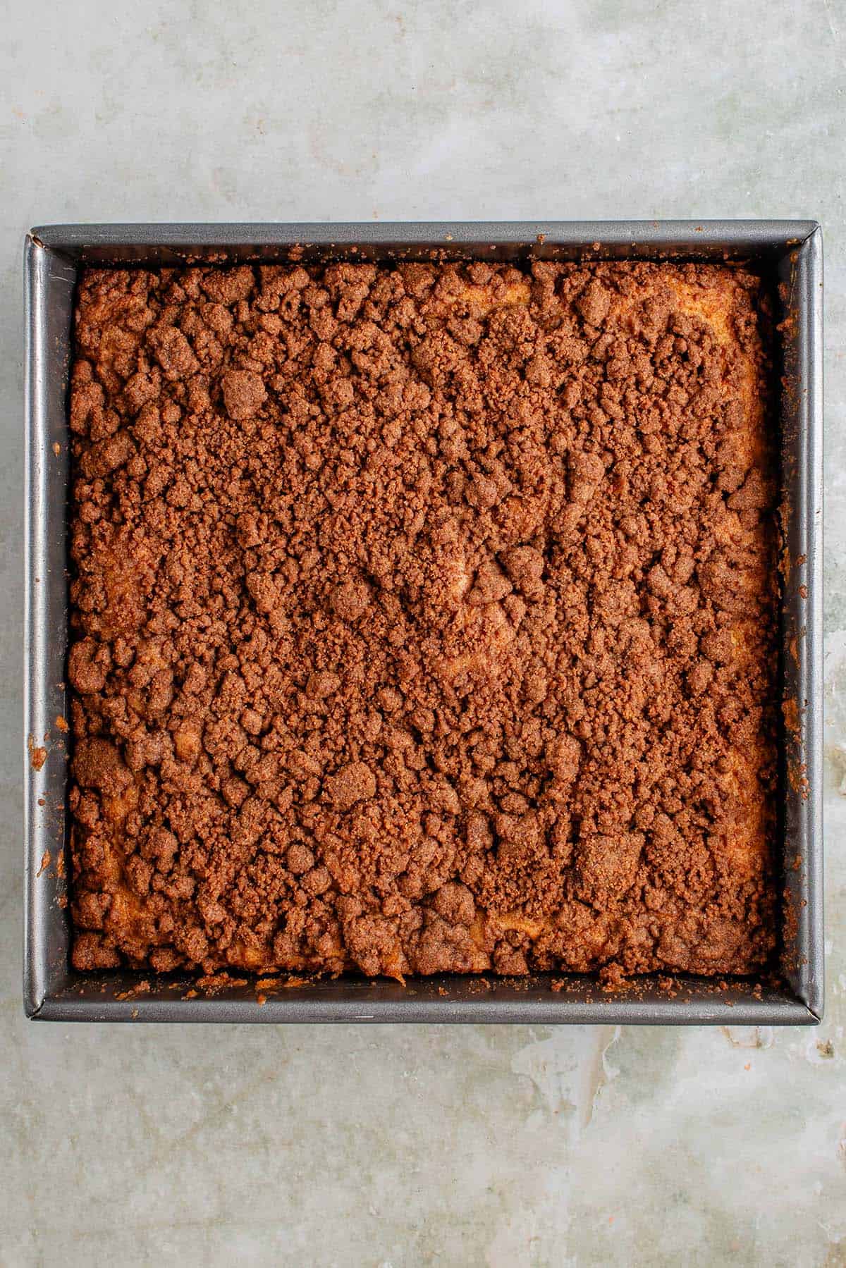 overhead photo of vegan coffee cake in pan after baking