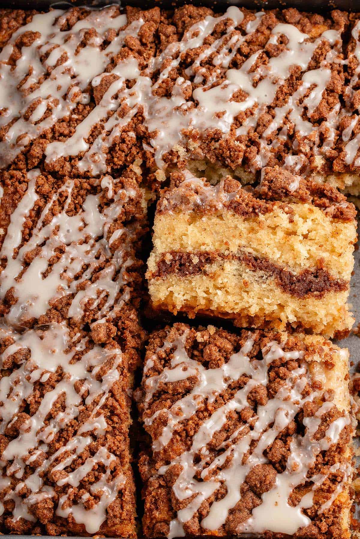 baking dish with slices of vegan coffee cake with one turned on its side