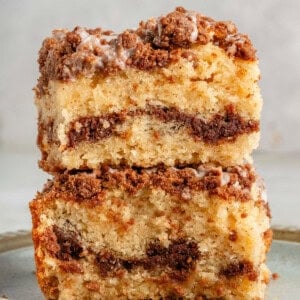 two thick slices of vegan coffee cake stacked on blue plate