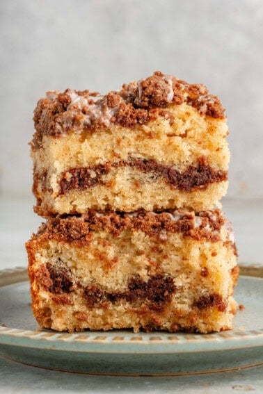 two thick slices of vegan coffee cake stacked on blue plate