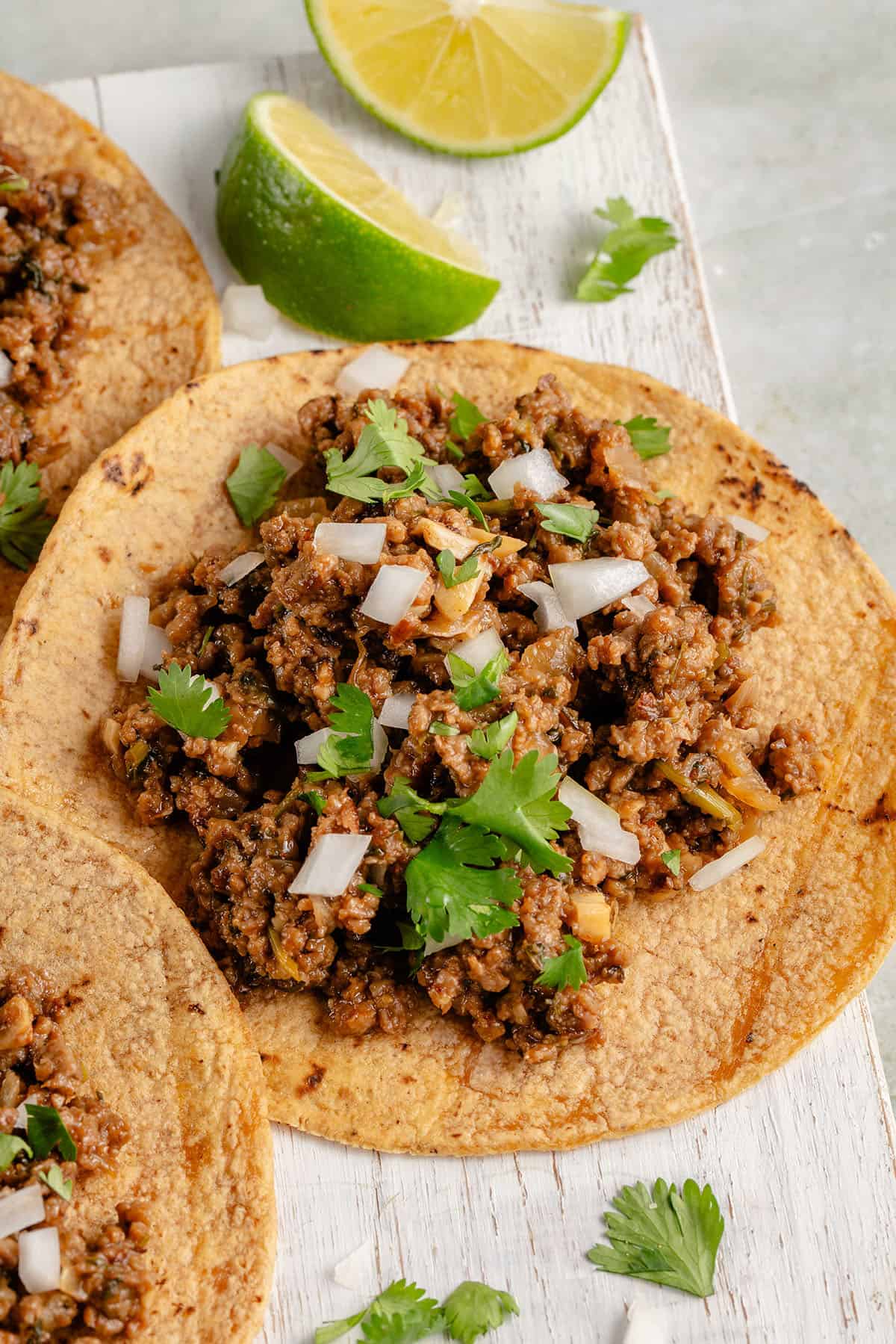 taco filled with vegan ground beef and topped with onion and cilantro