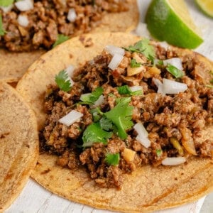 taco filled with vegan ground beef and topped with onion and cilantro