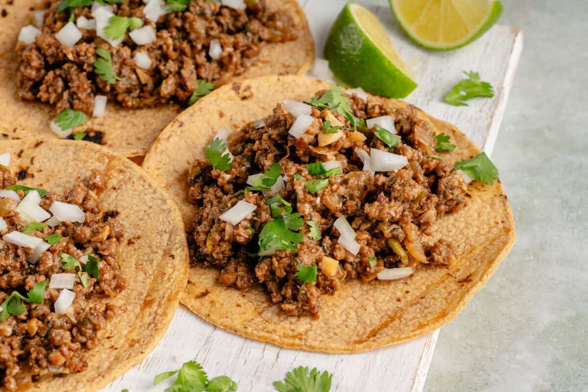 taco filled with vegan ground beef and topped with onion and cilantro