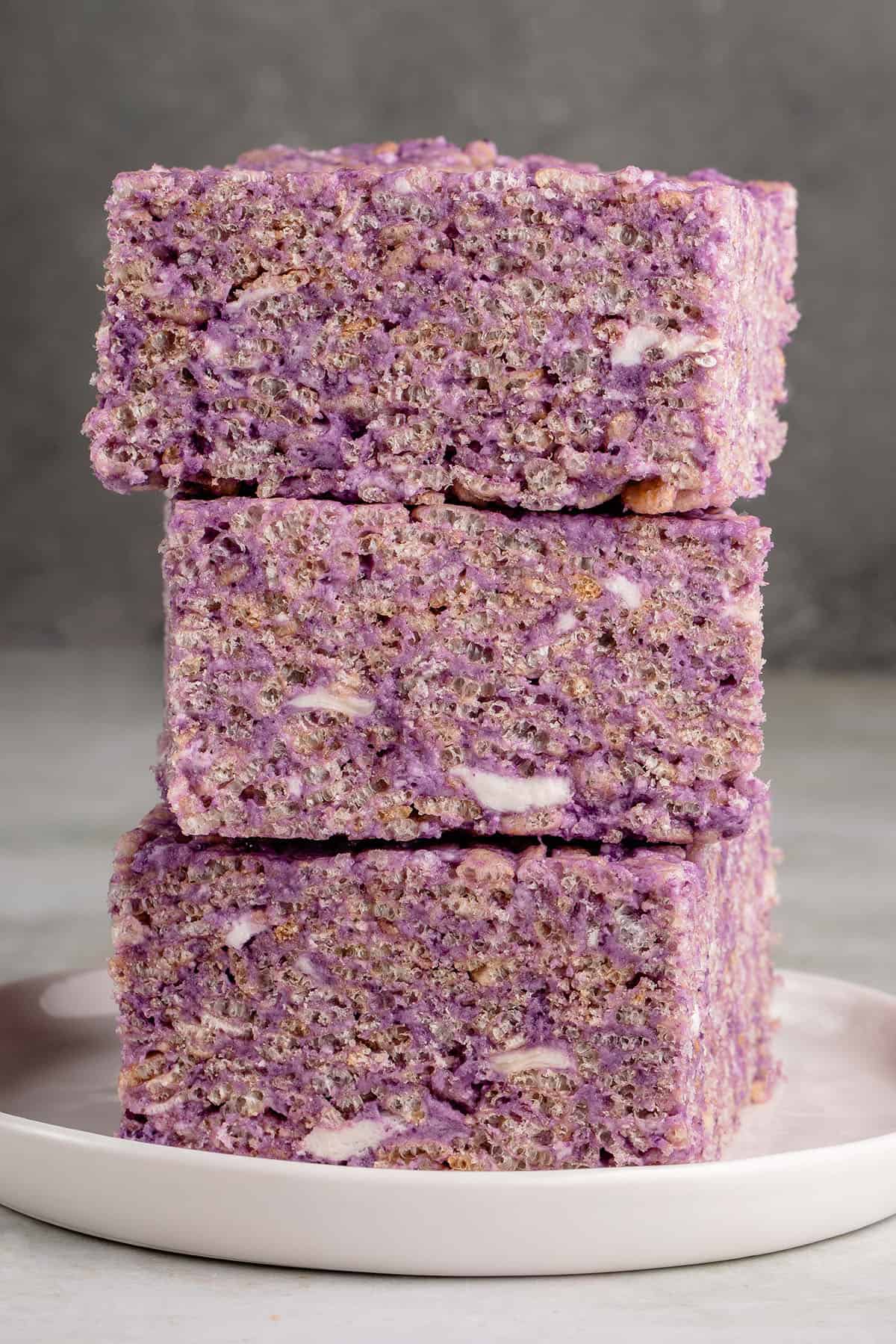 three ube rice krispie treats stacked on top of each other