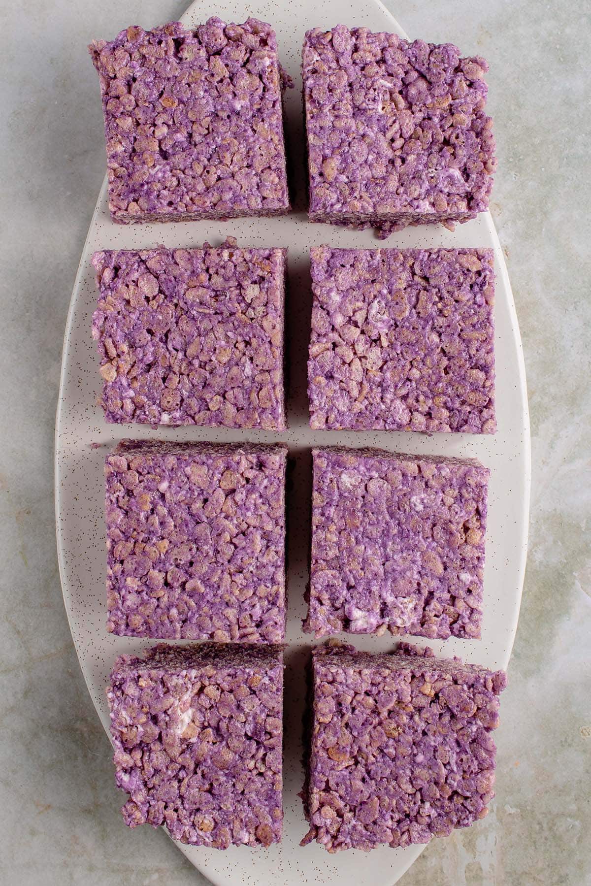 ube rice krispie treat squares on a white platter