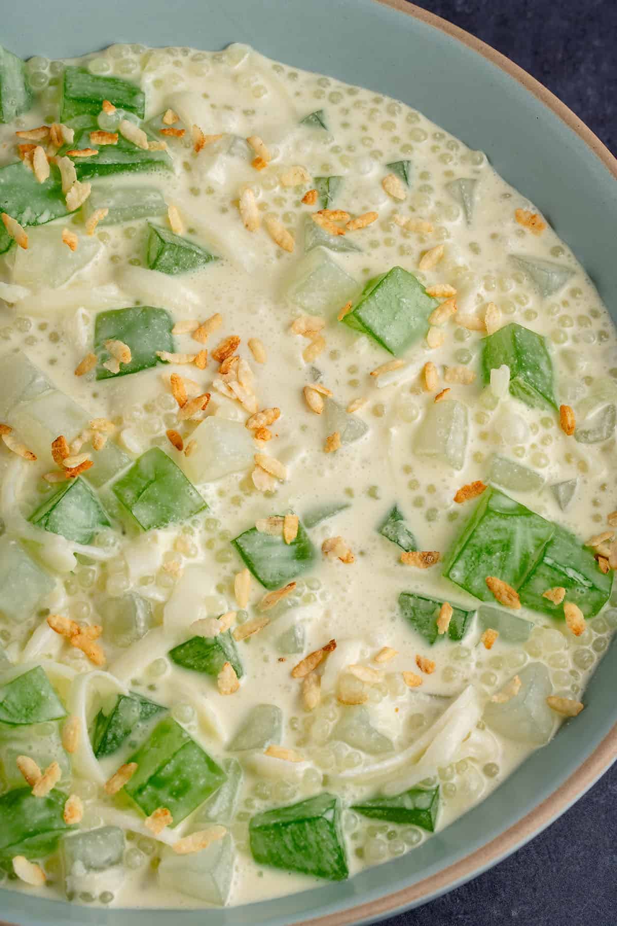 overhead photo of Filipino Buko Pandan Salad in light blue bowl