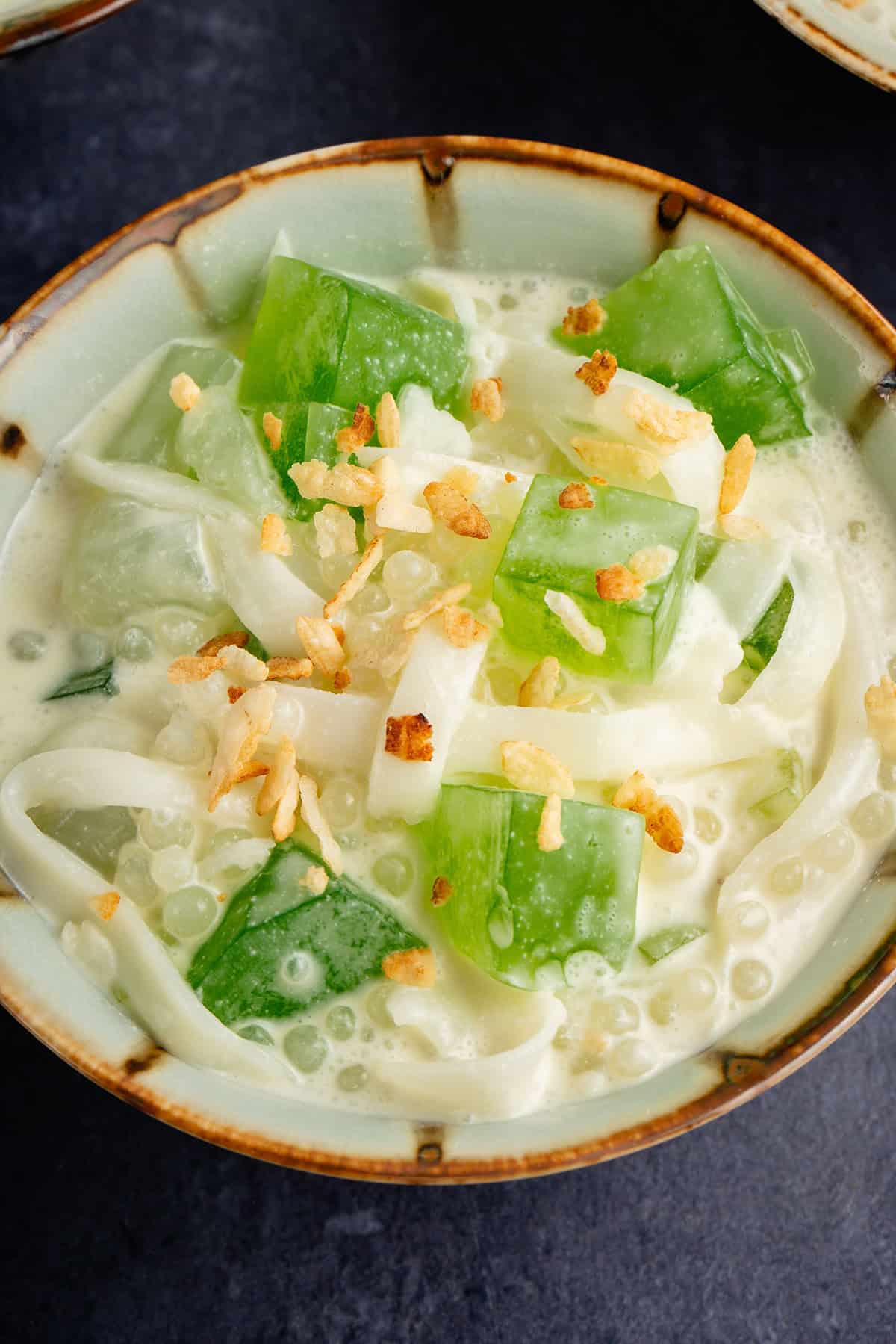 close up photo of a small bowl filled with Filipino Buko Pandan Salad