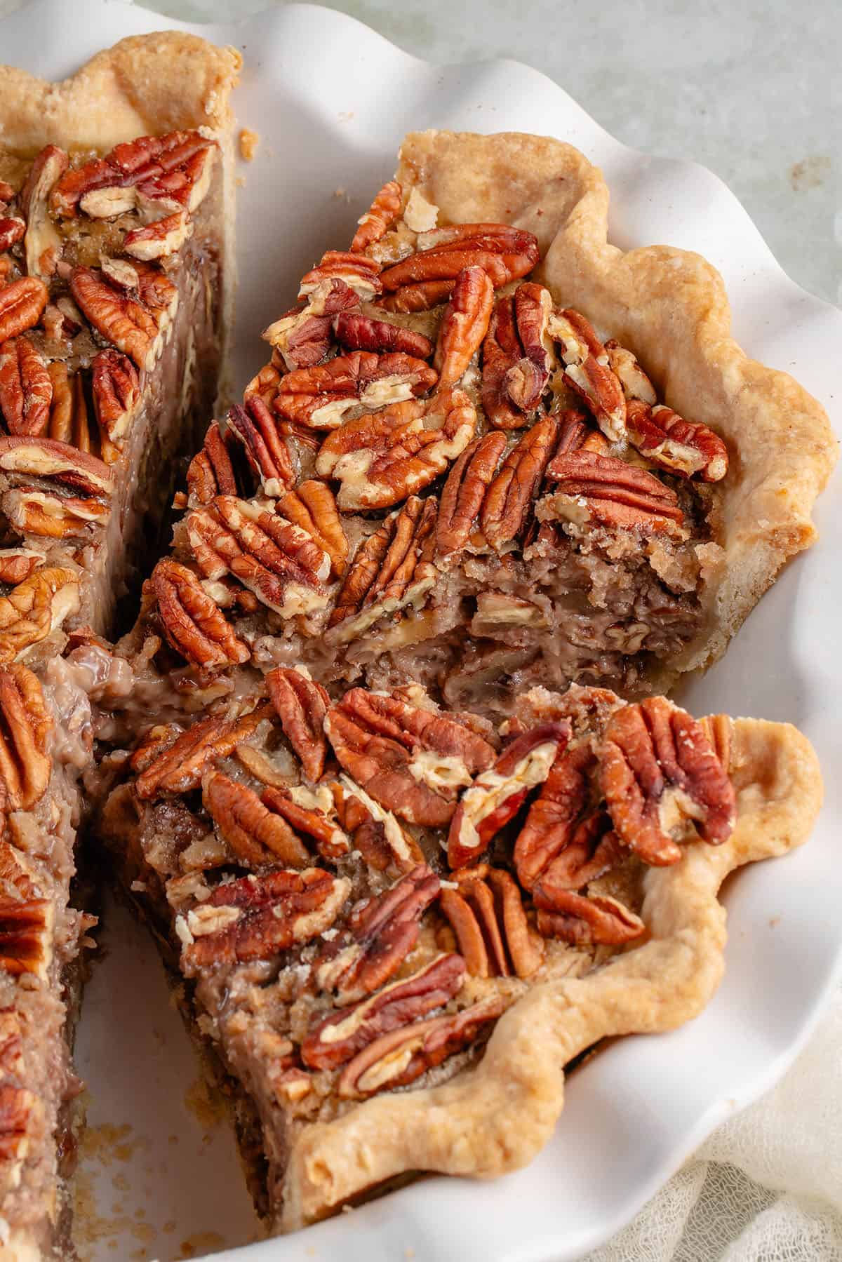 slices of pecan pie in pie dish