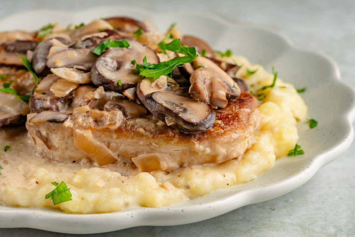 plate of mashed potatoes topped with creamy sherry tofu