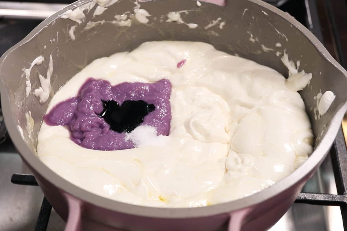 adding ube halaya and ube extract to the melted marshmallow mixture