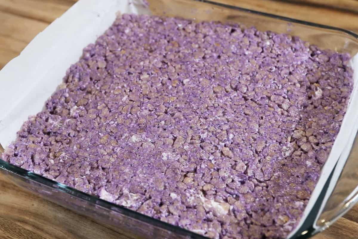 ube rice krispie treats in lined baking dish