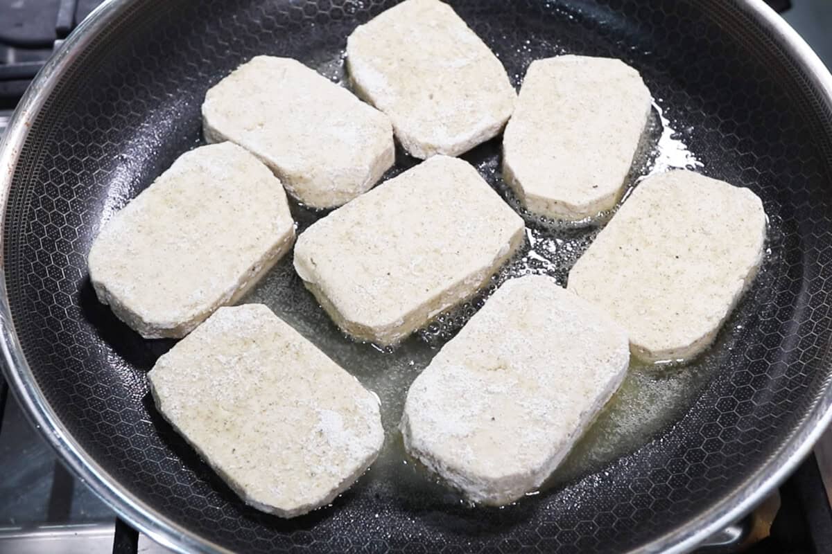 pan frying coated tofu slabs