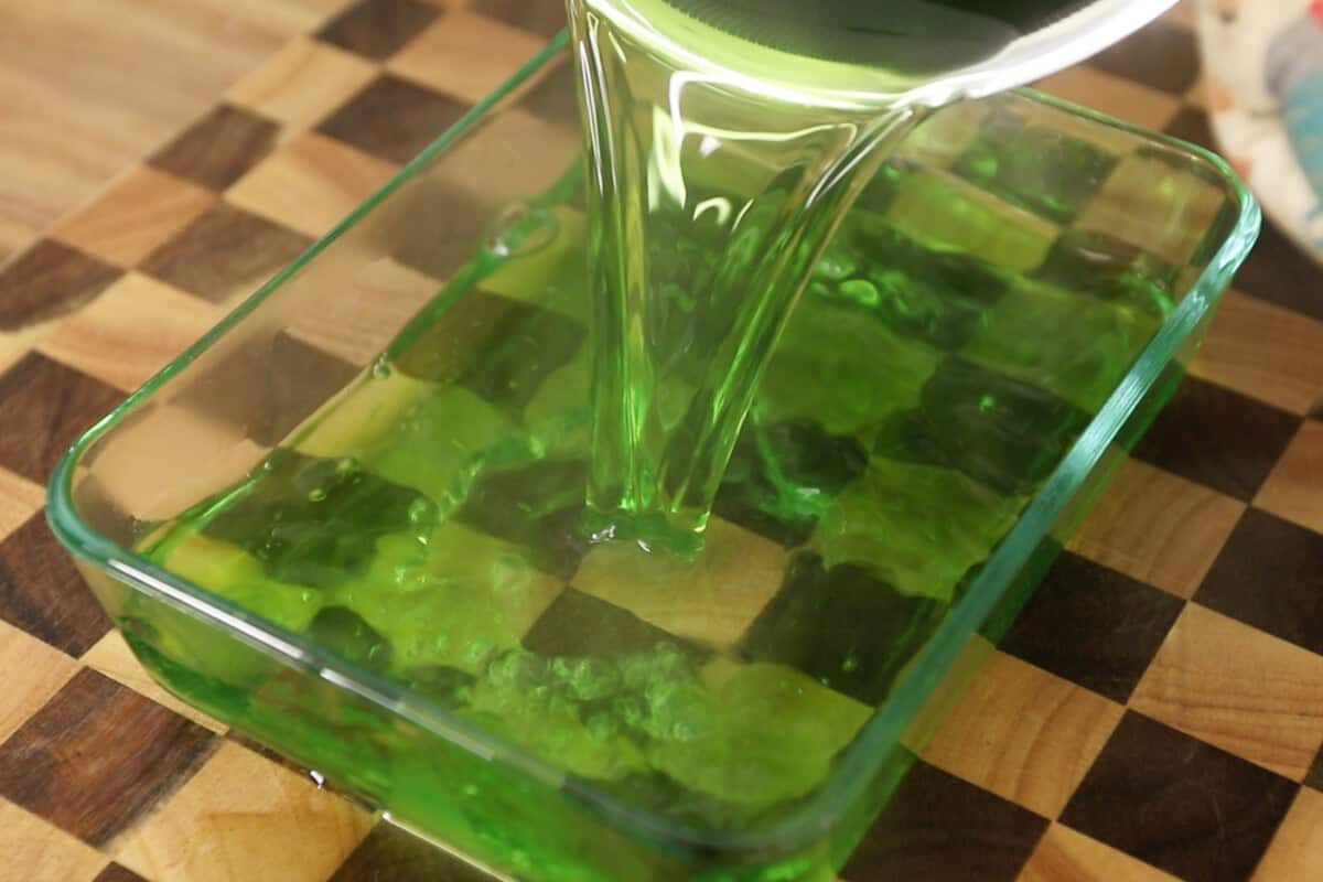 preparing pandan jello (gulaman) in glass dish for Buko Pandan