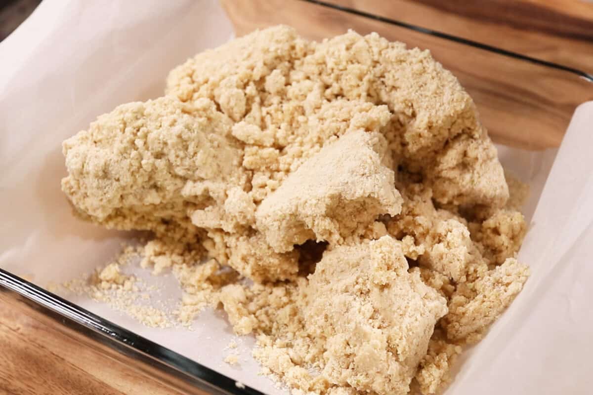 crumbled dough in a baking dish