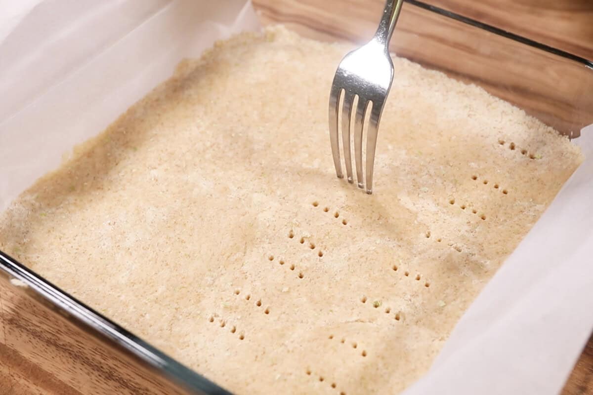 poking shortbread dough with a fork