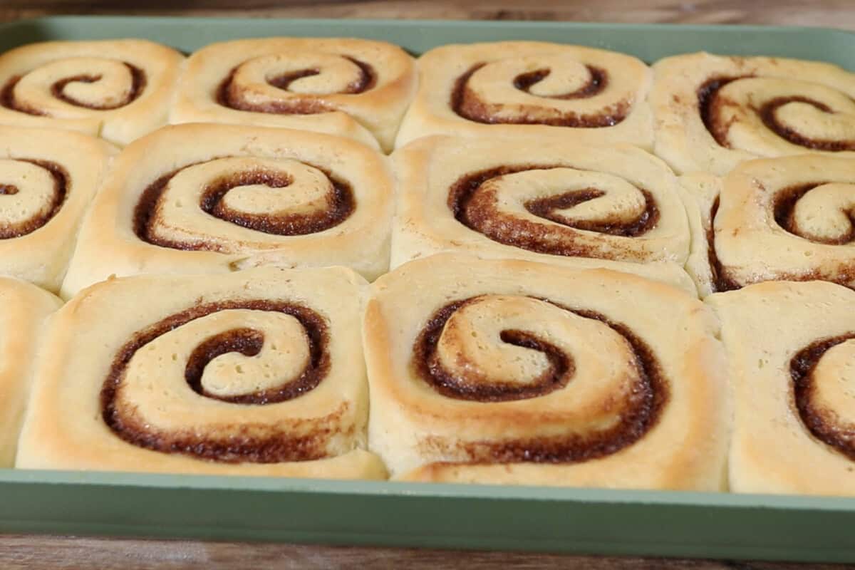 baked cinnamon rolls in a baking dish