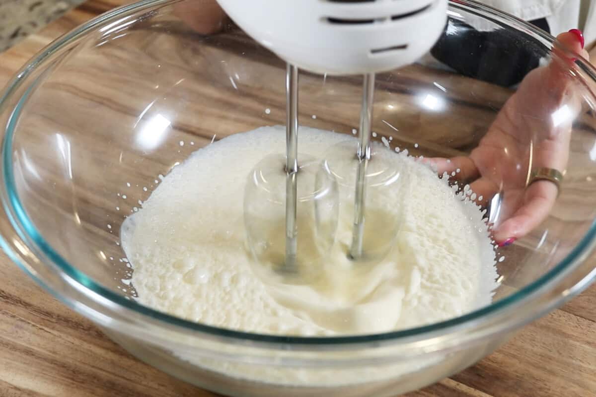 whipping the heavy cream and sugar together