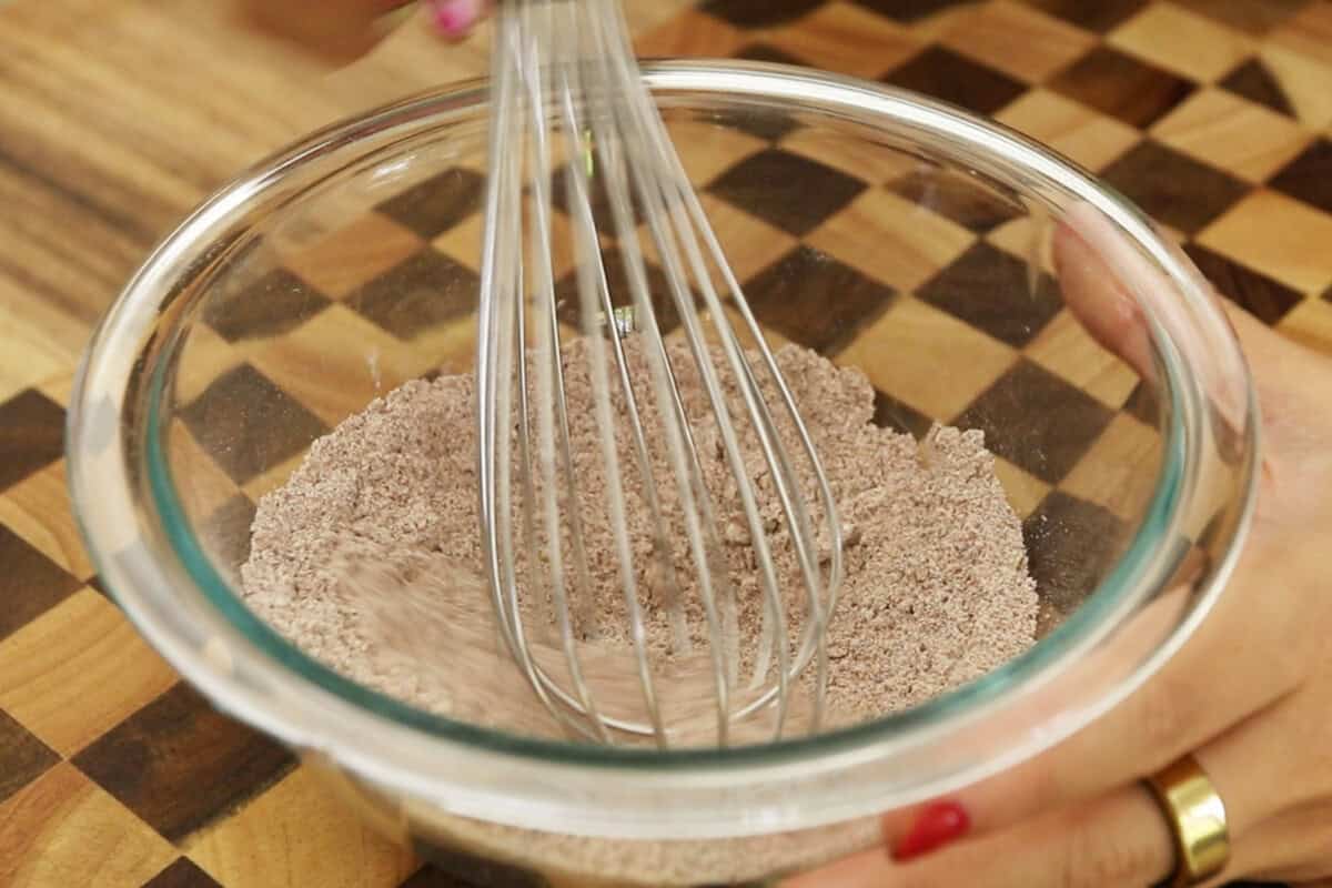 whisking together the spices in a bowl