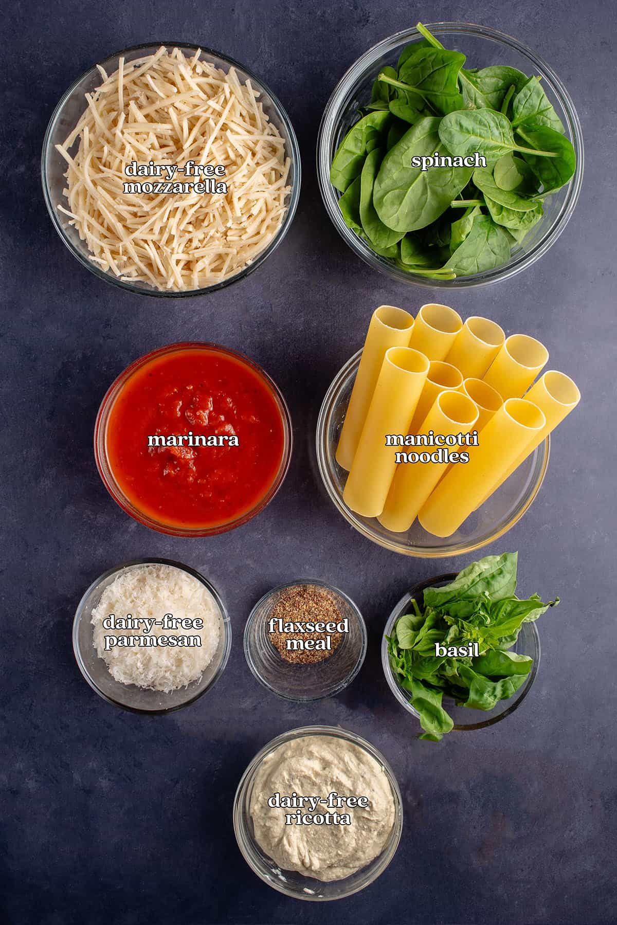 dairy-free mozzarella, spinach, marinara, manicotti noodles, dairy-free parmesan, flaxseed meal, basil, dairy-free ricotta