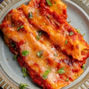 close up of a plate filled with vegan baked manicotti