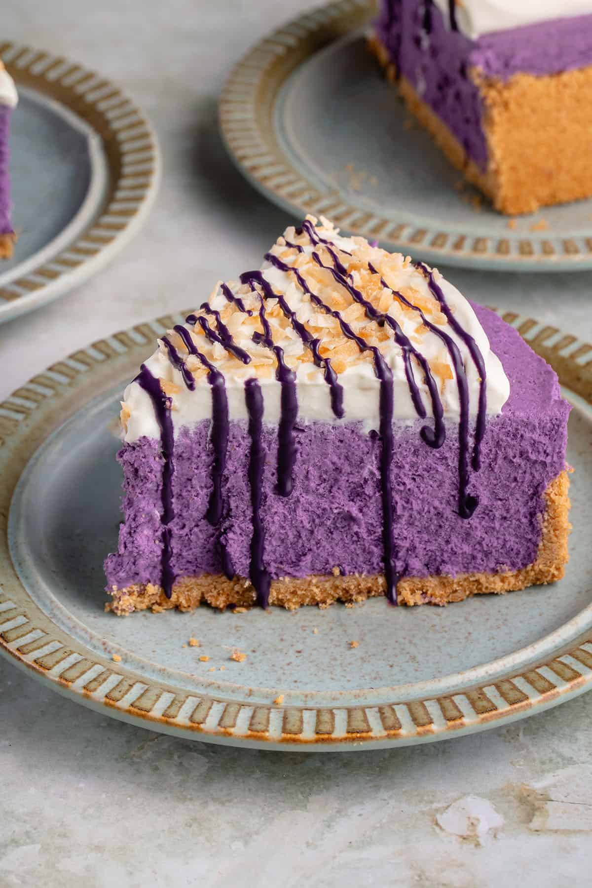 vegan ube cheesecake on a blue plate