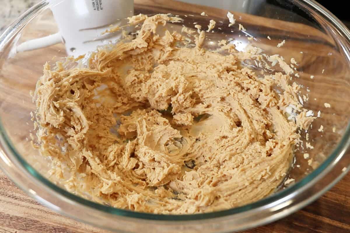 whipped cream cheese and peanut butter in a large glass bowl