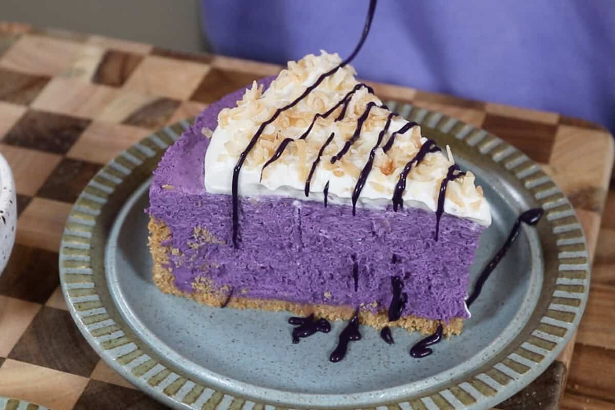 drizzling ube icing on cheesecake