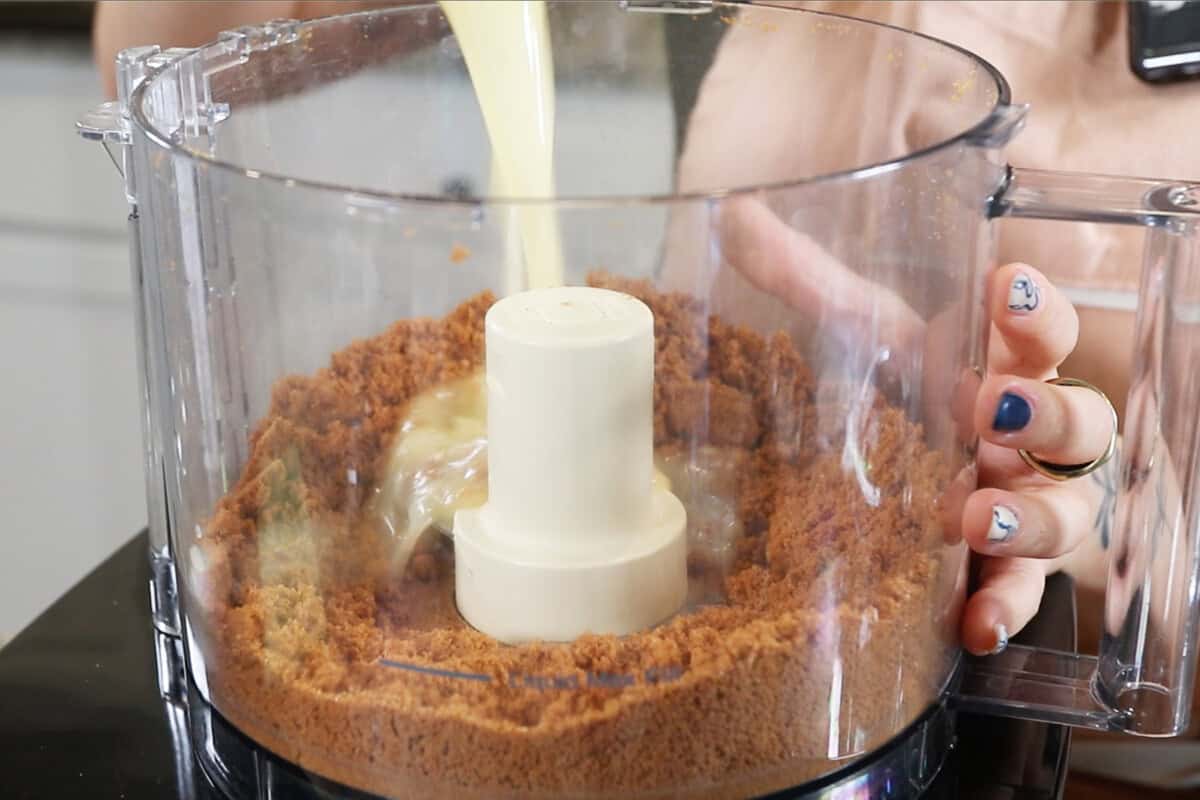 preparing a biscoff crust for cheesecake