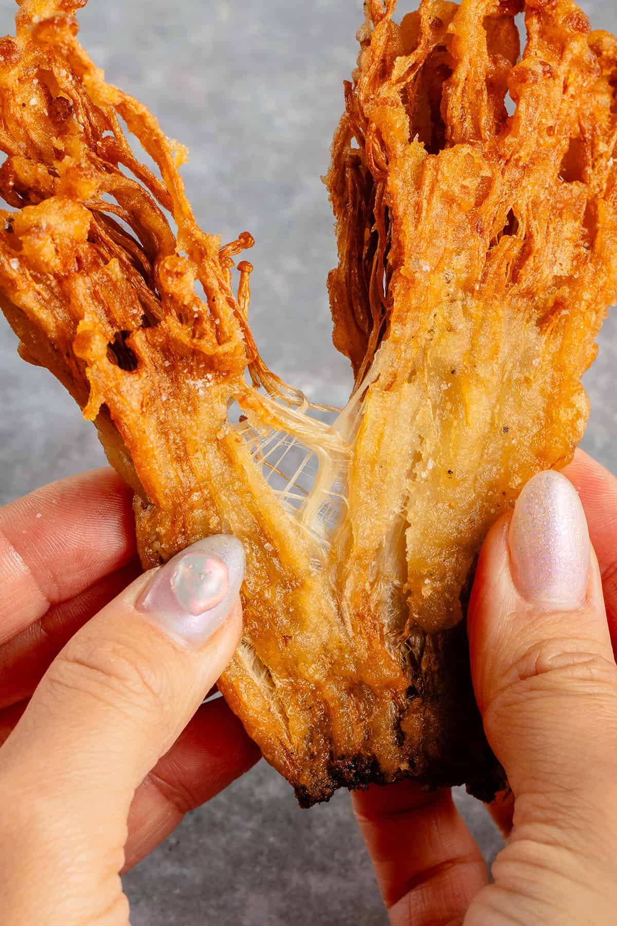 ripping apart fried enoki mushrooms